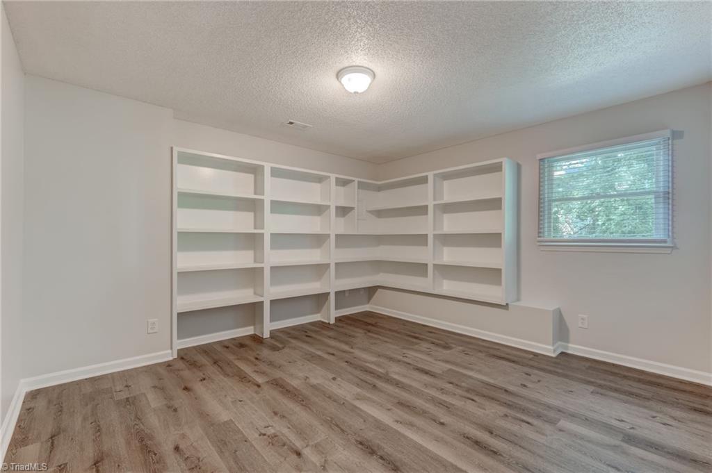Lower-level room with built-in shelves